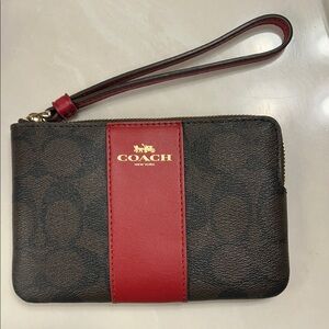 Coach Corner zip Wristlet in brown with red accent. New!